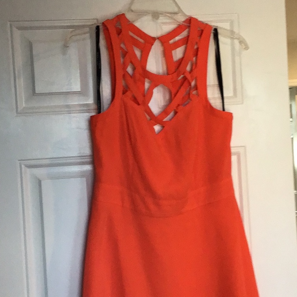 Coral Cocktail dress with cut away details